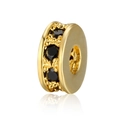 Macro view of gold rondelle spacer bead with black zircon inlay for DIY jewelry - Gold + Black Zirconia