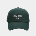Detailed close-up of white New York embroidery on a premium green cotton baseball cap - Dark Green