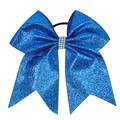 Detail of blue glitter hair bow with rhinestone center on white background - Sapphire Blue
