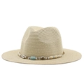 Close-up of straw fedora hat featuring bohemian seashell and turquoise bead decoration - Beige