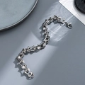 Silver stainless steel bracelet with unique bone link design on grey background - 1.1cm Width-Bone Link Design