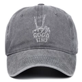 Detail of grey embroidery with skull hand and Good Vibes text on a washed baseball cap - Adjustable / Gray