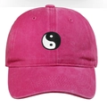 Close-up of Tai Chi Yin Yang embroidery on a magenta washed cotton baseball cap - One Size / Rose Red