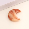 Polished orange and cream crescent moon natural agate crystal stone ornament on sand - Gold Silk Jade 2