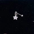 Macro shot of silver star-shaped cartilage earring with zircon on black velvet - Steel Color-Shiny Star
