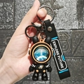 Space bunny astronaut keychain in black and orange with EXPLORE FUTURE silicone strap - Large Roaming Starry Sky Rabbit / Orange