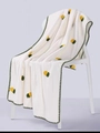 Detailed texture of white coral fleece towel with yellow pineapple embroidery on chair - 35×75cm / White (Pineapple)