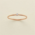 Minimalist rose gold ring with a single bezel-set round zircon in a sleek thin band - US 5 / April White (Gold Tone)