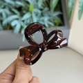 Close-up of deep amber tortoiseshell bow hair claw clip with a glossy finish - Glossy Reddish Brown - Small Bowknot