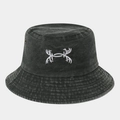 Detail of embroidered pattern and metal eyelets on washed cotton bucket hat - One Size / Army Green