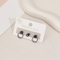 Black stainless steel earring set featuring star charms and a single black stud stone - Star Circle Style / Black