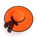 Detail view of orange woven straw hat showing the black mesh ribbon and refined spiral texture - M (56-58cm) / Orange