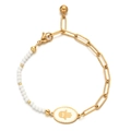 Macro shot of gold paperclip chain and Hamsa Hand pendant with natural crystal beads - White