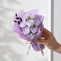 Detail of 7 purple soap roses bouquet wrapped in paper with a Just for you white ribbon - 7 Roses / Purple