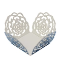Laser-cut white cupcake wrappers with intricate rose petal pattern for party decor - Reflective Blue