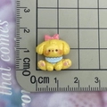 Macro view of mini yellow puppy resin charm with pink bow showing 2cm scale measurements - Yellow Bowtie Dog