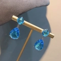 Elegant long drop earrings featuring light blue square and pear-cut crystal stones - Blue