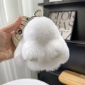 Cute white rex rabbit fur plush keychain with golden buckle held in hand - 10cm Bunny / White