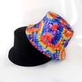 Detail showing black and tie-dye galaxy print reversible bucket hats on white background - Multi-Color Tie Dye
