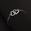 Bracciale argento minimalista con due ciondoli a cuore intrecciati e cristalli luminosi - Braccialetto da 1 pezzo / Argento