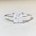 Macro shot of princess cut moissanite diamond with side stone accents on silver band - US 5 / Princess Cut 1.2ct Pave-Silver