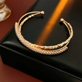 Detail of gold-plated double-layer open bangle with colorful zircon and micro-pave setting - Double Layer Pave Zirconia Beaded Style / Gold