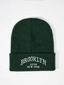 Detailed view of the dark green ribbed knit beanie with Brooklyn 1898 white embroidery - One Size / Dark Green