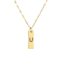 Macro shot of gold rectangle pendant necklace with colorful cubic zirconia letter U - Letter U