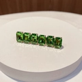 Close-up of emerald green rectangle rhinestones set on a gold finish hair clip - Square Green