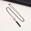 Macro view of geometric stainless steel necklace with black rectangle pendant detail - PN-1802 Pendant + 60cm Chain / Steel