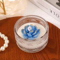 Blue lotus scented candle in embossed glass jar with gold foil accents on wooden tray - Blue Gold Foil Lotus Shape