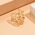 Close-up of golden crown metal hair claw clip with a polished finish on pink background - Crown Gold (C6203)