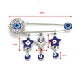 Detail view of 68mm silver Evil Eye safety pin brooch with Hamsa hand and star charms - Silver Star Charm - Talisman