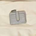 Minimalist grey faux leather multi-slot card holder with a gold zipper and button strap - Gray