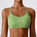 Seamless sports bra in light green with thin cross straps and ribbed support band - Green
