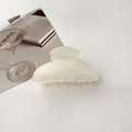 Close-up of a white translucent hair claw clip with subtle glitter on a minimalist table - 8cm Square Head / Starry Cream