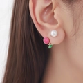 Elegant asymmetric tulip and pearl stud earrings worn by a model for a sweet floral look - ER753-04-Magenta Rose Pearl