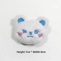 Detail view of plush white bear brooch with heart embroidery and 7x8cm dimensions - Bear Brooch Style
