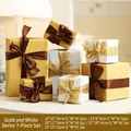 7-piece gold and white Christmas gift box set with elegant ribbon bows for festive decor - Gold & White Series 7-Piece Set