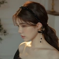 Elegant black beaded headband with asymmetric bow and tassel earrings for women - Black