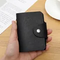 Black anti-degaussing card wallet with textured faux leather and silver metal clasp - 24 Slots / RFID Black