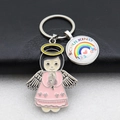 Detail of metal keychain with pink angel girl and Schulkind rainbow glass charm - Peach