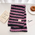 Detailed close-up of pink and black striped wool knit scarf with ins woven label - 174cmx25cm / Pink Black