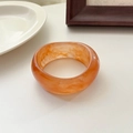 Wide orange marble resin bangle bracelet with a minimalist polished finish for women - Translucent Red Brown