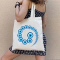 Graffiti Greek Evil Eye print canvas tote bag carried by a model on a white shoulder - STD1804-S Spiral Geometric Eye