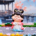 Chibi Tang lady figurine holding a rabbit in Chang'e style with blue gradient dress - Holding Rabbit Style / 【product Attributes】a Q-version Ancient-style Female Figure Figurine Shaped Like Chang'e Flying To The Moon. The Figurine Has A Black Double-bun Hairstyle Wears Gold Hair Accessories And Pink Flowers Wears A Blue And White Gradient Chinese-style Long Dress And Is Draped With A Pink Sash. She Holds A Cute Little White Rabbit In Her Arms. The Material Appears To Be Environmentally Friendly Resin Or Pvc. 【visual Presentation】the Image Was Taken With Macro Photography The Composition Is Upright And The Main Body Of The Product Is Located In The Visual Center. The Background Uses A Miniature Landscape To Simulate Pavilions And Autumn Trees In A Chinese Garden Creating An Excellent Sense Of Artistic Conception. Image Quality Is [high] With Sharp Details And Rich Colors. Aesthetics Are [high] Overall Score Is [9.2] And The Overall Sense Of Breathability Is Excellent. 【text Content】no Post-processed Text Or Text Inherent To The Product Was Detected In The Entire Image. 【logistics Tags】none. 【infringement Risk】product Infringement: None Appears To Be A General Q-version Figurine Style. Infringement Probability [0.1]. Background Infringement: None. 【product Parameters】q-version Figurine Ancient Style Theme Resin Material Colorful With Rabbit Accessories.