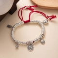 Detail of red braided New Chinese style bracelet with silver lucky charms and pendants - L393-2 Iridescent Color (Red Rope)