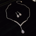 Macro shot of silver teardrop necklace and earring set with pearls on black velvet - Classic Water Drop Full Diamond Set / Silver