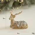 Renna di Natale dorata con glitter e paillettes blu, decorazione seduta da 8 cm - Renna Seduta