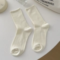 Vertical ribbed cotton mid-tube socks in cream white color with a minimalist aesthetic - One Size / Cream